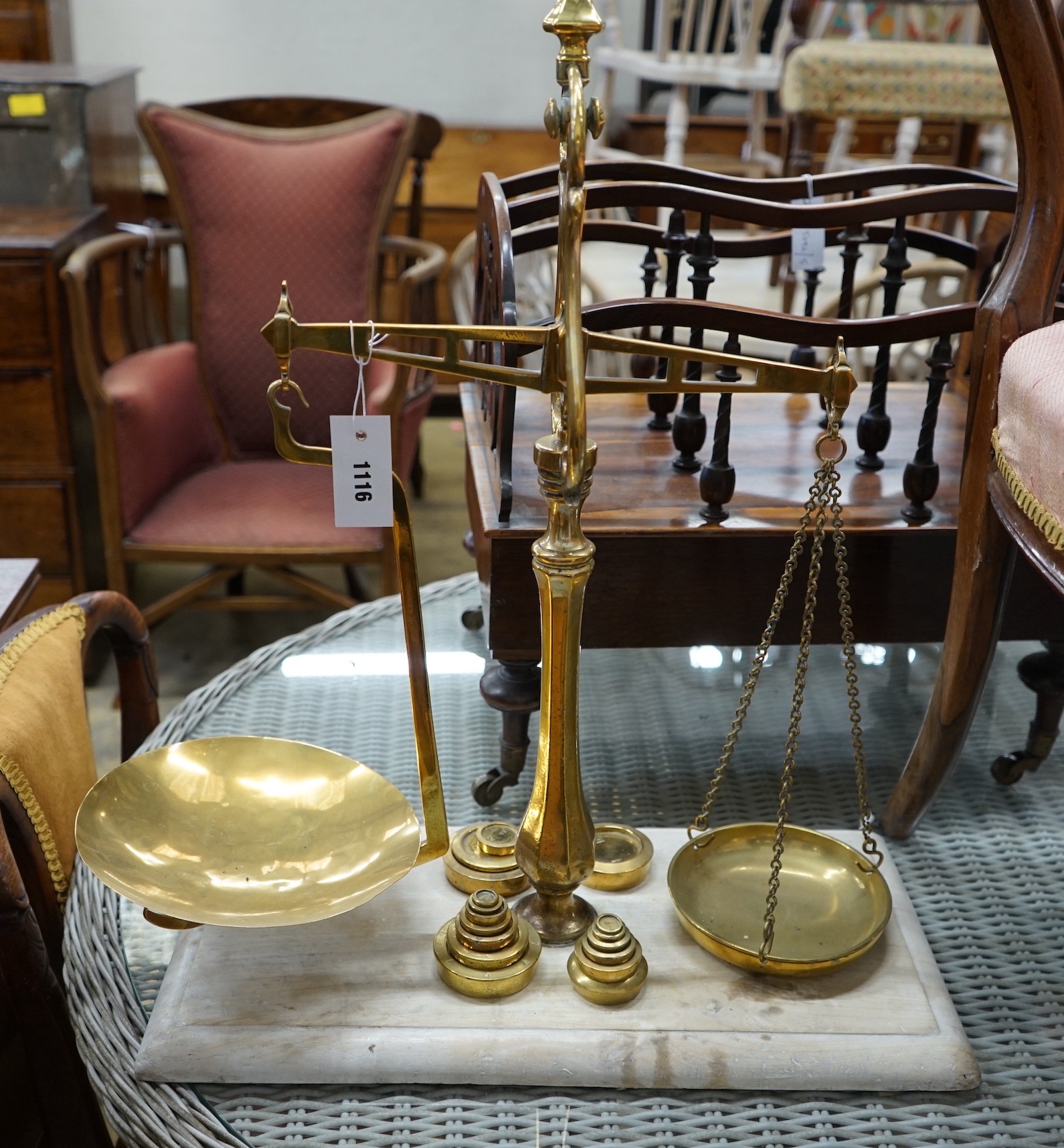 A set of Victorian brass balance scales with weights, height 69cm